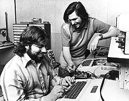 Steve Woznaik (Sitting) and Steve Jobs